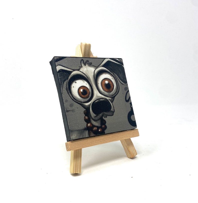 Mad J Gifts Enigmatic Paws mini canvas print. Gray background with big eyed dog.