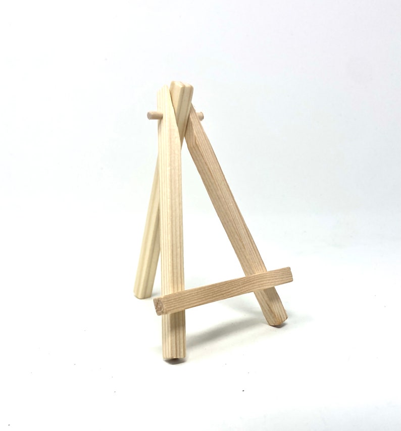Mad J Gifts wood easel for mini canvas prints.