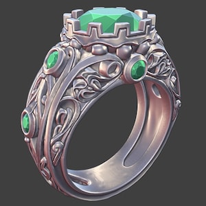 May include: A silver ring with a large, faceted green gemstone at the center, surrounded by a crown-like setting. The ring features smaller green gemstones and ornate, swirling details along the band. The ring is a piece of jewelry.