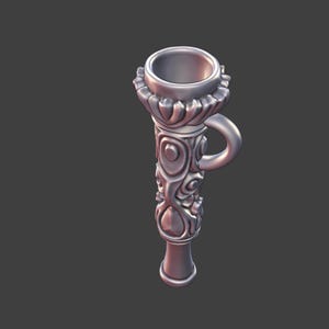 May include: A silver-colored, ornate torch-shaped object with a handle. The top has a flared, ridged design, and the body features swirling, floral-like patterns. The handle is a small, curved loop.