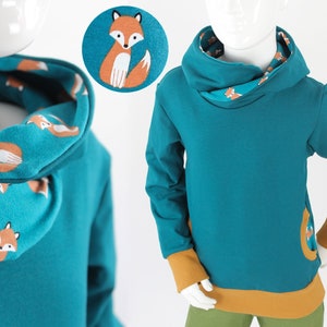 Yellow children's hoodie with foxes