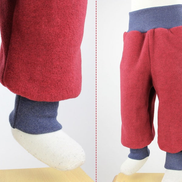 Tobe trousers made of red mottled eco-fleece, with pockets, grow with you for a long time, cuddly soft, heat-retaining and water-repellent