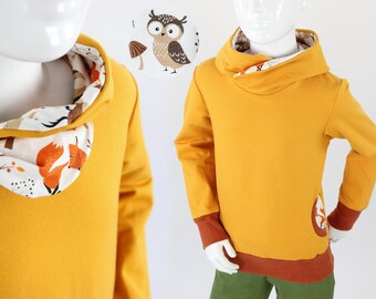 Yellow children's hoodie with foxes