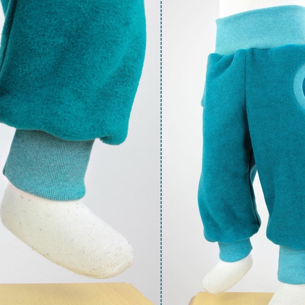 Tobe trousers made of petrol mottled eco-fleece, with pockets, grow with you for a long time, cuddly soft, heat-retaining and water-repellent