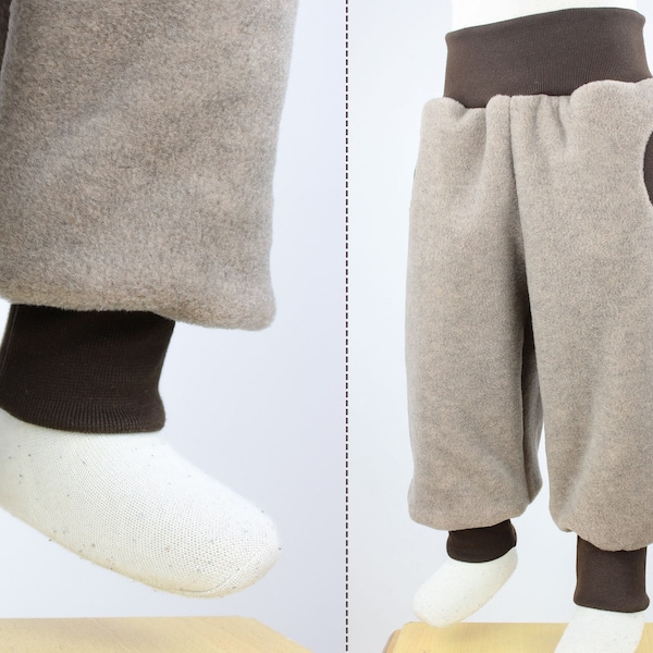 Tobe trousers made of beige mottled eco-fleece, with pockets, grows with you for a long time, cuddly soft, heat-retaining and water-repellent