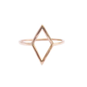 Very thin wire creating the outline of a diamond shape with thin wire as the ring band. Shown in gold tone or gold fill with a light hammered finish.