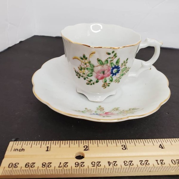 Made in Occupied Japan demitasse teacup and saucer. Lovely floral piece