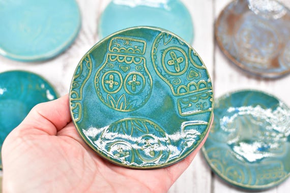 Hand-painted sugar skull stoneware spoon rest that doubles as a ring dish — genuinely functional, quirky, and actually handmade at a great price.