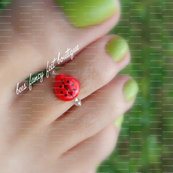 Anneau élastique d’orteil élastique d’étirement de bouton de coccinelle rouge