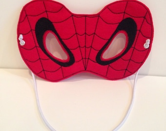 May include: Red felt Spider-Man mask with black eye holes and a white elastic strap.