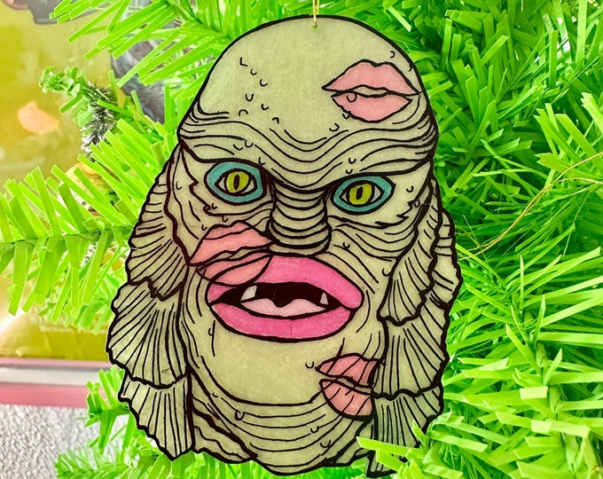 Creature kisses ornament