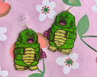 Creature wind up toy earrings