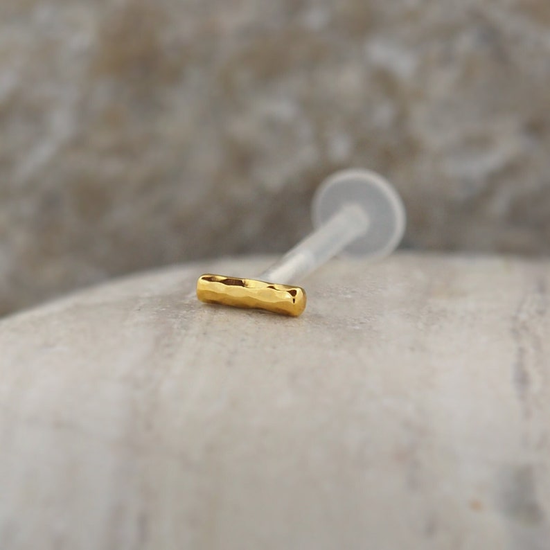 Small bar tragus and helix earring made from bioflex. This lightweight design is flexible and comfortable, making it a great choice for all-day wear.