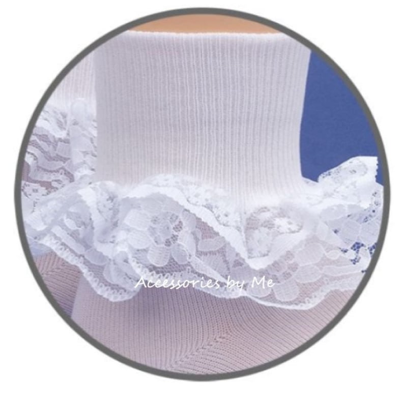 May include: White socks with a white lace ruffle at the top. The socks are ribbed and the lace is delicate.
