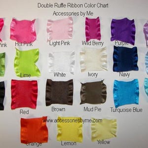 May include: A Double Ruffle Ribbon Color Chart by Accessories by Me featuring twenty-two fabric swatches in various colors including Shocking Pink, Hot Pink, Light Pink, Wild Berry, Purple, Lavender, Kiwi, Lime, White, Ivory, Navy, Lt. Blue, Black, Red, Brown, Mud Pie, Turquoise Blue, Turquoise, Orange, Lemon, and Yellow.