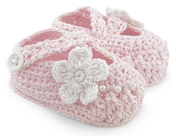 May include: A pair of pink crocheted baby shoes with white crocheted flowers and pearl accents.