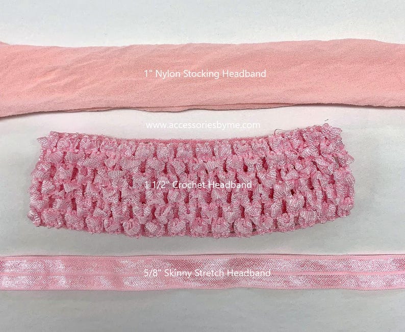 May include: Three pink headbands: a 1" nylon stocking headband, a 1 1/2" crochet headband, and a 5/8" skinny stretch headband. The text www.accessoriesbyme.com is visible between the top and middle headbands, along with their specific labels.