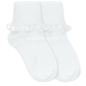 May include: A pair of white ankle socks with a ruffled lace trim at the top. The socks have a ribbed cuff and the text "Accessories by Me" is printed on the socks.