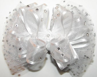 Lazo para el cabello de tutú de organza blanca y plateada con pinza de diamantes de imitación.