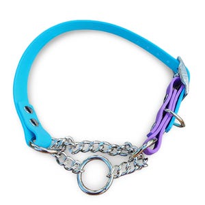 May include: A bright blue collar featuring a purple adjustment section with a silver metal buckle. The collar includes a silver chain link attachment connected to a central silver O-ring, secured with silver rivets on the blue strap.