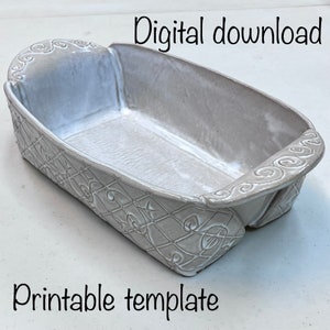 Picture of finished pottery bread pan with text saying “digital download, printable template.”