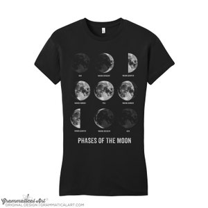 May include: Black t-shirt with a graphic of the phases of the moon. The text "Phases of the Moon" is printed below the graphic.