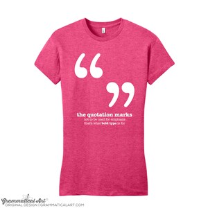 May include: Pink t-shirt with white text that says "66 the quotation marks not to be used for emphasis that's what bold type is for".