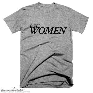 May include: A heather grey t-shirt with the text "elect women" printed in black.