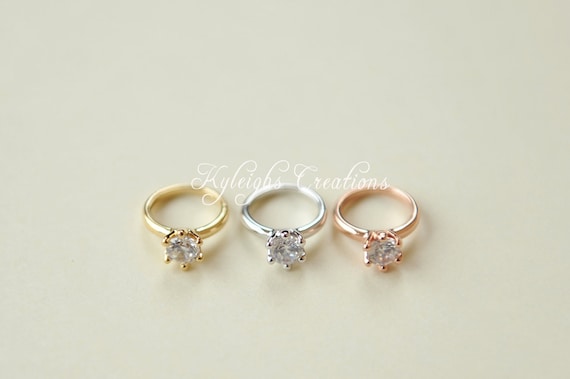 Newborn-Shoot-Singapore-father-and-mother-wedding-rings-on-baby-toes |  White Room Studio