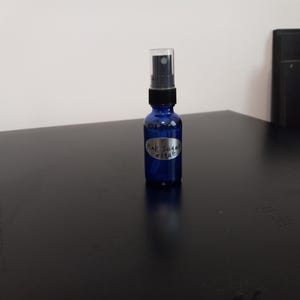 Bruma corporal &quot;Refleja la energía negativa&quot; con aroma a azúcar rosa