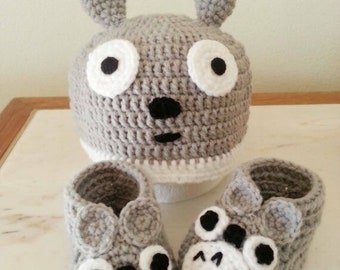 Handmade crochet baby booties and matching hat.