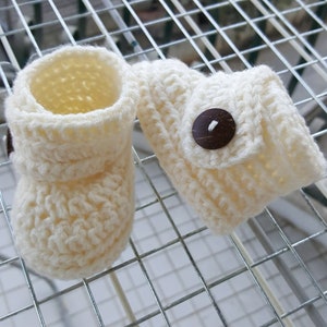 Crochet baby booties.  Colour you choose.