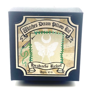 May include: A black box with a vintage-style label that reads "Witches Dream Pillow Kit Headache Relief Ages 10+". The label features a green and white moth with a crescent moon above it.