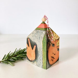 Vintage book home ornament face in window