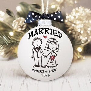 Personalized Wedding Gift Married Ornament - Hand painted white glass ball ornament with whimsical bride & groom. "Married" above figures, first names & date below. Polka dot bow attached. First Christmas Newlyweds Bridal Shower Gift Bride Groom Ornament