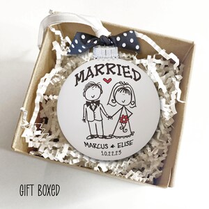 Personalized Wedding Gift Married Ornament - Hand painted white glass ball ornament with whimsical bride & groom. "Married" above figures, first names & date below. Polka dot bow attached. First Christmas Newlyweds Bridal Shower Gift Bride Groom Ornament