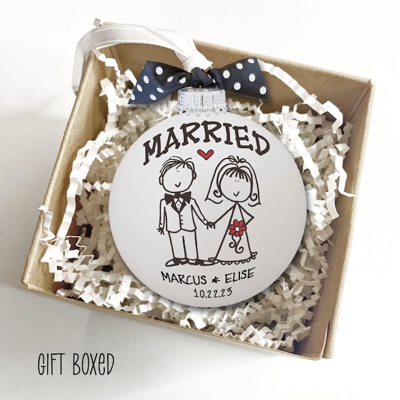 Personalized Wedding Gift Married Ornament - Hand painted white glass ball ornament with whimsical bride & groom. "Married" above figures, first names & date below. Polka dot bow attached. First Christmas Newlyweds Bridal Shower Gift Bride Groom Ornament