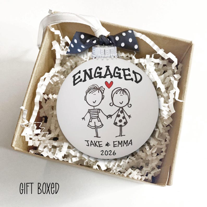 Personalized Engagement Ornament - White glass ball ornament, hand painted with whimsical couple holding hands with ENGAGED above them and names and year below. Little red heart and polka dot bow. Engaged Couple Gift Custom Names Date, Keepsake Bridal Shower Present