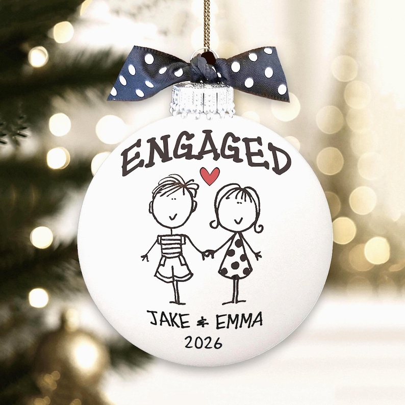 Personalized Engagement Ornament - White glass ball ornament, hand painted with whimsical couple holding hands with ENGAGED above them and names and year below. Little red heart and polka dot bow. Engaged Couple Gift Custom Names Date, Keepsake Bridal Shower Present