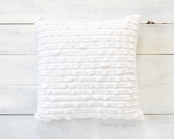white ruffle pillows