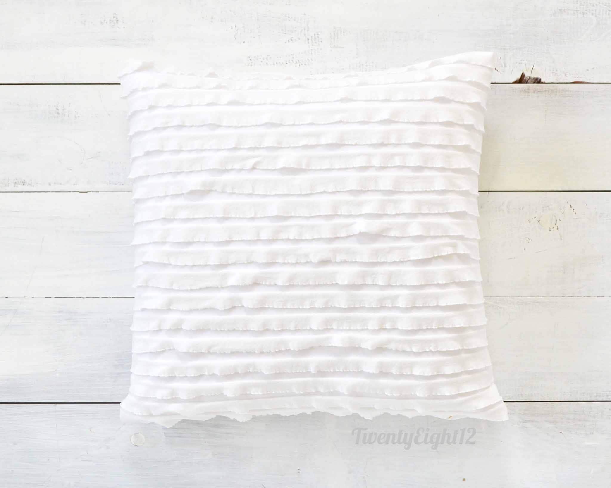 white ruffle cushion