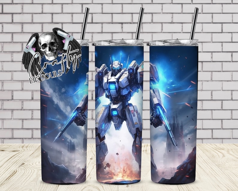 May include: A stainless steel tumbler featuring a blue and white illustration of a robot in a futuristic setting. The robot is holding a weapon and has glowing blue eyes.