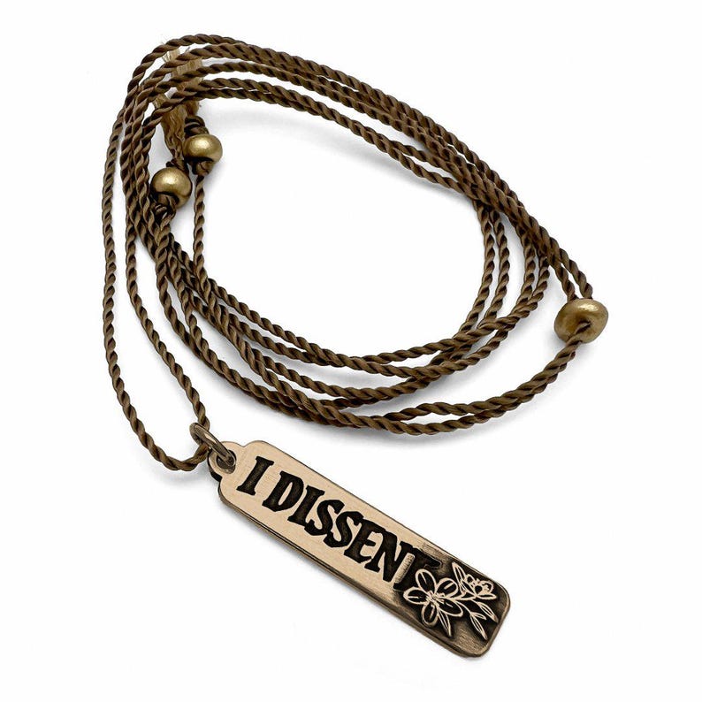 Bronze necklace with 'I Dissent' pendant on a white background