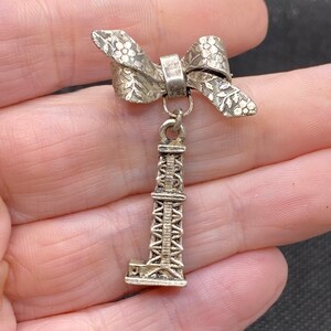 Vintage Bow Pin with oil Pump Texas Tower charm