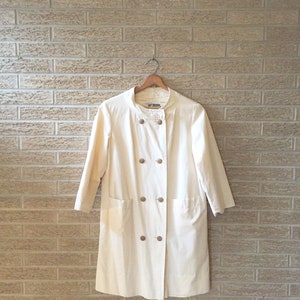 Luxe peacoat, small/ great feel/ silky lined/ lightweight subtle/ unique combination of materials/ wood buttons/ size small