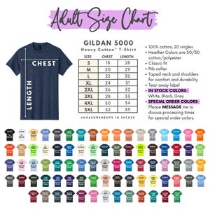 The image is an adult size chart for a GILDA 5000 heavy cotton T-shirt. It includes a chart with measurements in inches and a list of color options, along with a list of color options and their corresponding measurements. The chart and color options are presented in a visually appealing manner, with a variety of colors and sizes available for the shirt.