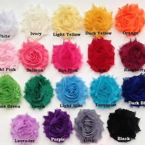 May include: A collection of fabric flowers in various colors, including white, ivory, light yellow, dark yellow, orange, light pink, salmon, hot pink, red, raspberry, lime green, green, light blue, turquoise, dark blue, lavender, purple, grey, and black.