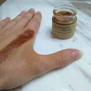 This is my hand with shade 5 applied on top of cream and dry next to it on the right. I am usually a shade 3. I hope this helps you but please order a sample find your shade set before a full size since these are so hard to tell online. These shades darken in person as well so go lighter than you think!