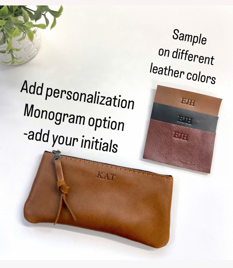 May include: A brown leather pencil case with a zipper closure and a monogrammed "KAT" on the front. The image shows a sample of the case in different leather colors with the initials "EJH" embossed on each.