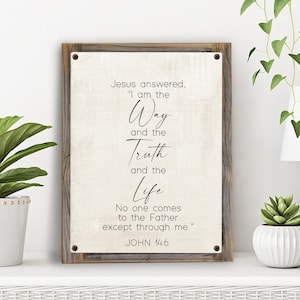 May include: A rustic wooden sign with a white background and black text. The text reads "Jesus answered, "I am the Way and the Truth and the Life. No one comes to the Father except through me." John 14:6"